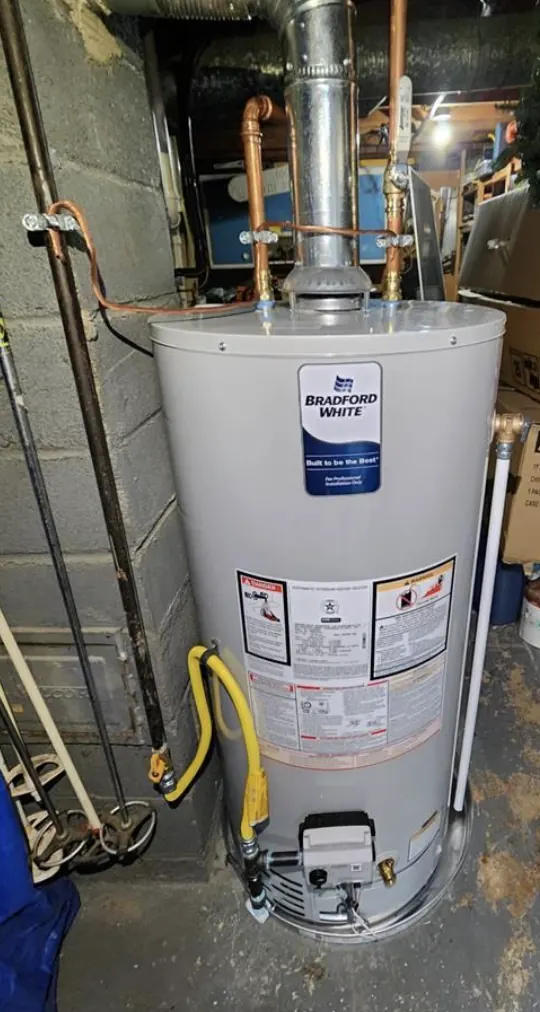 Gas tank water heater with flue pipe and gas control valve in a block basement &mdash; Foothills Water Heaters